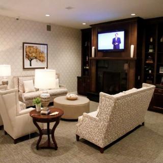 A cozy living room with comfortable seating and a television.