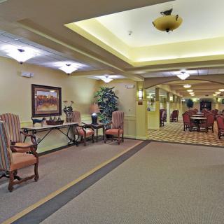 A spacious and elegantly decorated lobby area with comfortable seating and warm lighting.