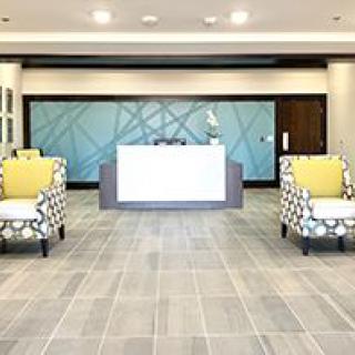 A modern office reception area with stylish seating.