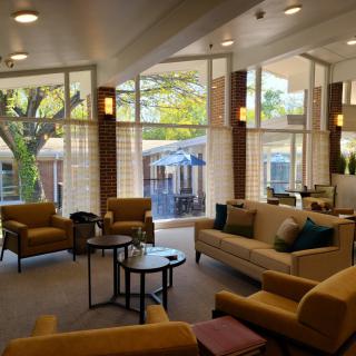 A modern lobby with comfortable seating and large windows allowing ample natural light.