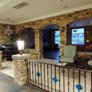 Cozy interior with brick walls and a comfortable seating area.