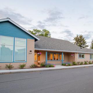 A modern residential-style building with a well-maintained exterior and landscaping.