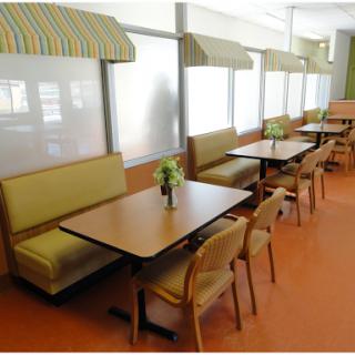 A cozy dining area with booth seating and tables, designed for casual meals.