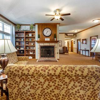 Cozy living room with a central fireplace and comfortable seating.