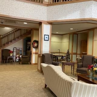 A cozy and inviting lobby space with comfortable seating and seasonal decor.
