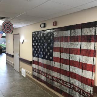 A creatively designed American flag mural embellishes the hallway, adding a touch of patriotism to the space.