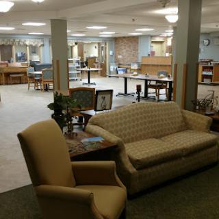 A spacious library interior featuring comfortable seating arrangements.