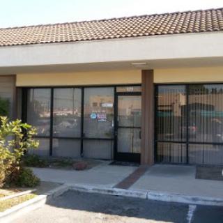 An empty storefront in a commercial plaza.