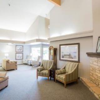 A cozy living room with comfortable seating and a fireplace.
