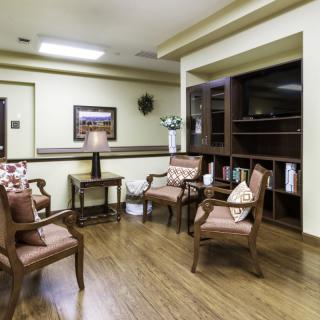 A cozy waiting room with comfortable chairs and elegant decor.