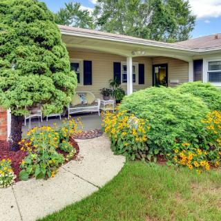 Charming home with a beautifully landscaped front yard and inviting porch.