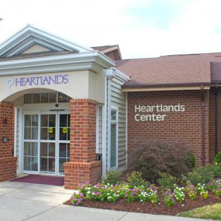 Front entrance of Heartlands Center with a landscaped area.