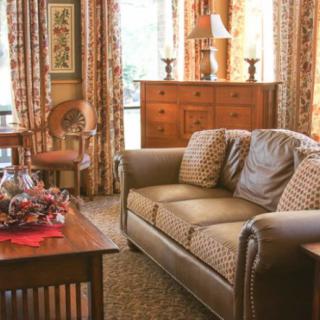 A cozy living room with a comfortable sofa and classic decor.