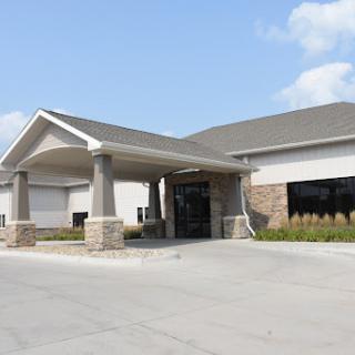 A modern building with a covered entrance, suggesting hospitality or office use.