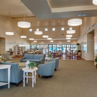 A spacious and modern lobby area with comfortable seating and stylish lighting fixtures.