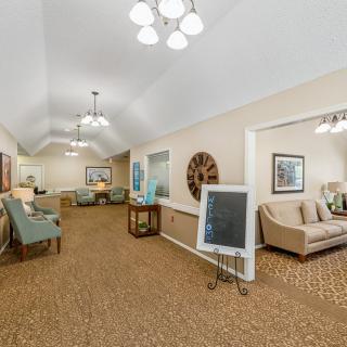 A spacious and well-lit living area with comfortable seating and elegant decor.