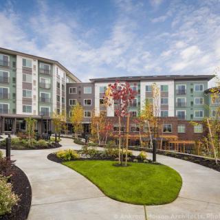 A modern apartment complex with landscaped outdoor areas.