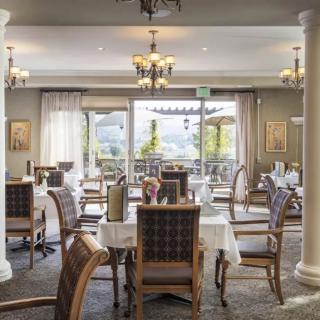 Elegant dining area with neatly arranged tables and classic decor.