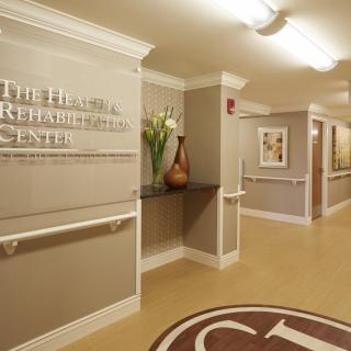 The hallway of a rehabilitation center featuring elegant decor and clean design.