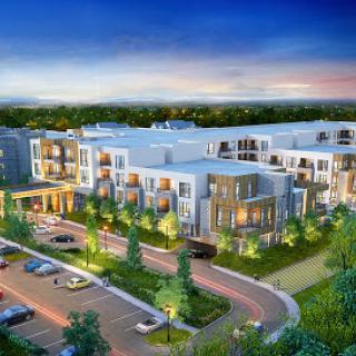 A modern residential complex showcasing elegant design and lush landscaping under a serene evening sky.