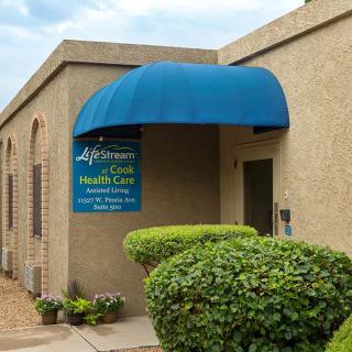 Entrance to a healthcare clinic with a blue awning and signage.