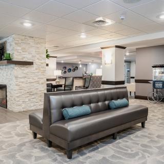 A modern lobby with contemporary seating and neutral decor.