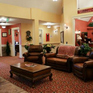 A cozy living room with comfortable sofas and a wooden coffee table.
