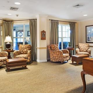 A cozy living room with comfortable armchairs and soft lighting.