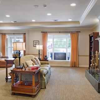 A cozy living room with elegant furniture and warm lighting.