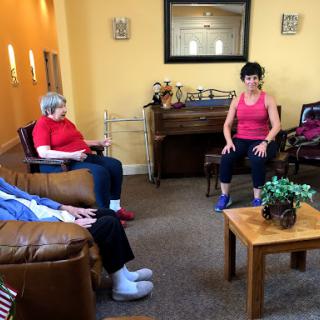 Seniors participating in a group exercise session at a community center.