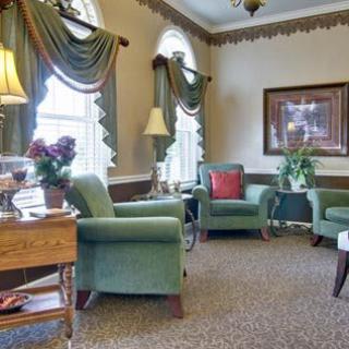 A cozy living room with elegant decor and comfortable armchairs.