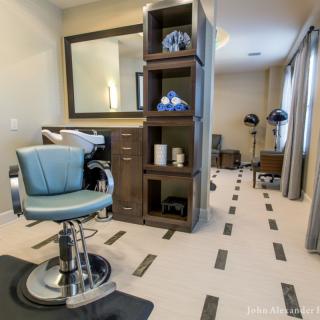 Modern barbershop with stylish interior and salon equipment.