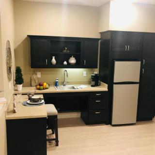 Modern apartment kitchen with sleek cabinetry and appliances.