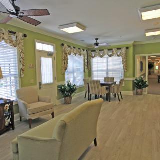 A cozy living and dining area with elegant decor and natural light.
