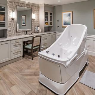 A luxurious spa room featuring a modern whirlpool bathtub and elegant décor.