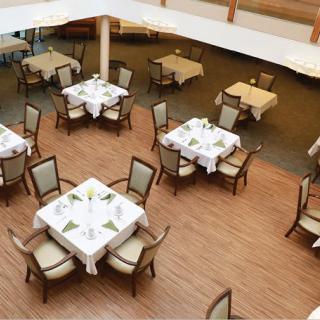 An aerial view of a restaurant dining area with neatly arranged tables and chairs.