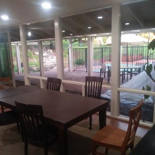 Indoor dining area with a view of the patio.