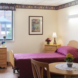 A cozy bedroom with a single bed and stylish decor.