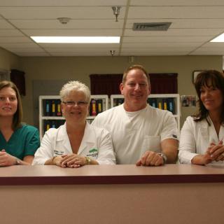 A group of healthcare professionals standing in a hospital setting.