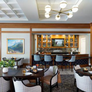 A stylish and modern bar lounge with comfortable seating and elegant decor.
