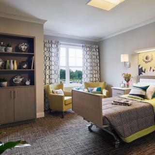 A cozy modern bedroom with a hospital bed and stylish interior decor.