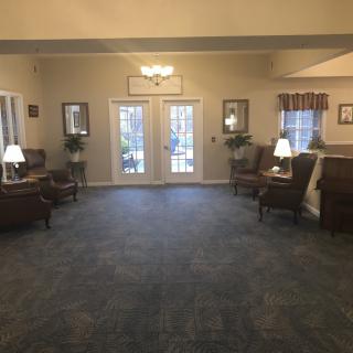 A spacious lobby area with comfortable seating and soft lighting.