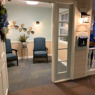 A cozy waiting area with modern decor and comfortable seating.