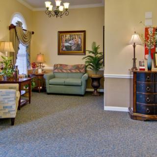 A cozy living room with comfortable seating and elegant decor.