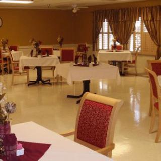 A well-decorated indoor dining area with tables and chairs.