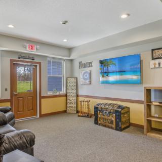 A cozy waiting room with comfortable seating and calming decor.