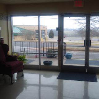 A view of the lobby with large windows showcasing the outside environment.