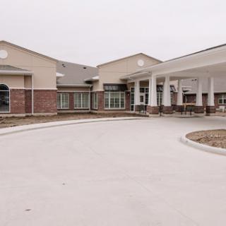 A modern facility showcasing a welcoming entrance and landscaped surroundings.