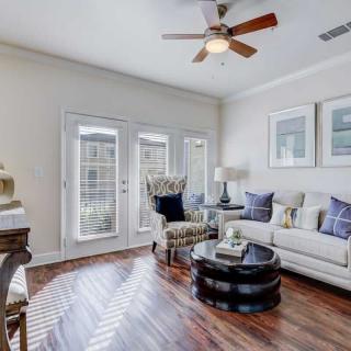 A stylish living room featuring a comfortable sofa, elegant coffee table, and tasteful decor.