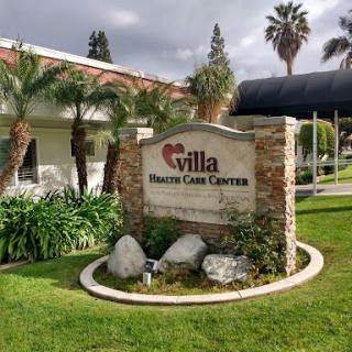 Entrance to Villa Health Care Center with landscaped surroundings.